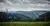 Panoramablick auf das bewaldete Bergische Land mit Wolken am Himmel und einer Stromleitung, an der Vögel sitzen.